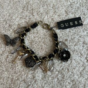 GUESS Gold and Black Charm Bracelet with Crystals